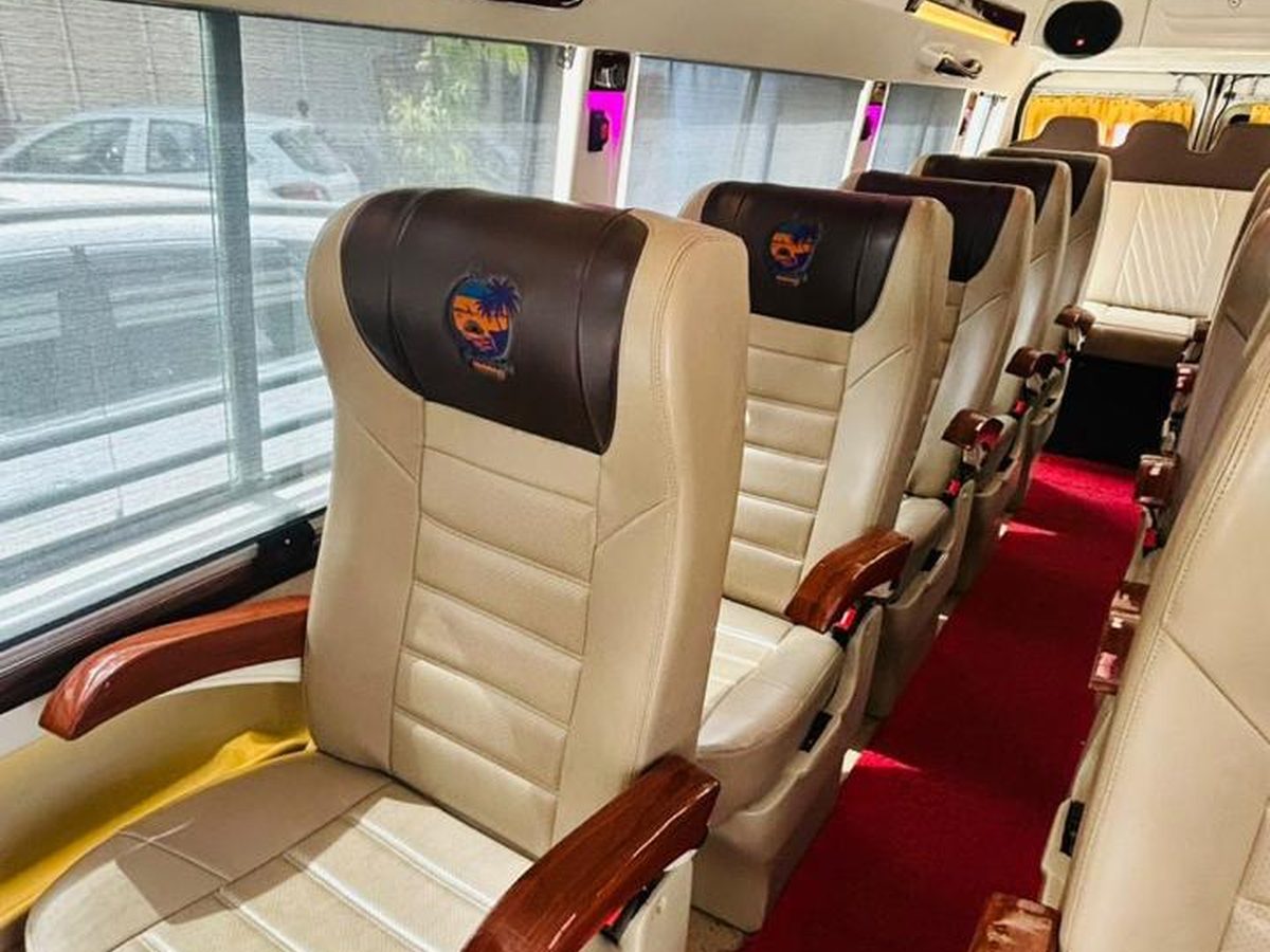 Maharaja pushback seating inside a Vinayak Tours and Travels tempo traveller